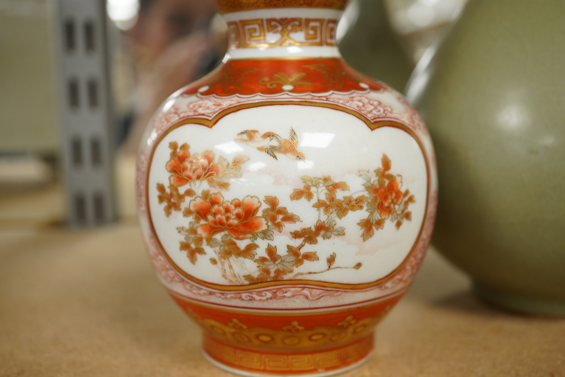 A Chinese celadon crackle glazed vase and a Japanese Kutani vase, tallest 22cm. Condition - good